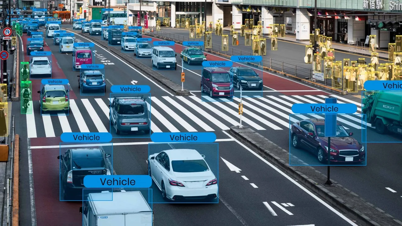 Example of vehicle and pedestrian detection annotation on a street scene